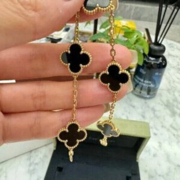 Van Cleef & Arpels 18K gold onyx 5-flower bracelet